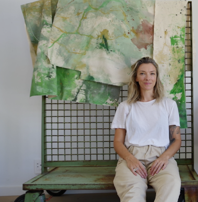 Nicky Myny in the studio in front of a large painting